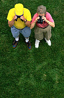 Two seniors looking through binoculars