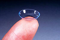 Contact lens on fingertip