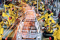 Robotic arms welding car frames on Saturn assembly line. Tennessee. USA