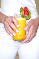Woman holding orange juice, detail