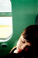 Woman sleeping in train