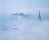 Edinburgh Castle and old town in the fog. Edinburgh. Scotland