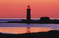 Lighthouse at sunset at Omoe Island. Denmark