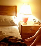 Womans legs in a motel room