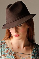 Image of young woman wearing hat
