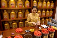 Sales clerk in tea shop. Beijing. China