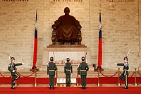 Changing the guard at Chiang Kai Shek Memorial with Chiang Kai Shek´s statue in the background, Taipei, Taiwan.