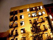Blurred apartment building in New York´s East Village. The image was captured at night, and has a ghostly feel. USA.