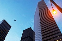 Seattle, Washington State, USA - Plane flying above city's skyscrapers
