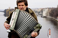Blind accordion player on the Charles Bridge. Prague. Czech Republic.