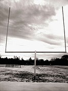 A goalpost at a high school football in Upstate, New York is captured against a dramatic sky.