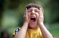 Headshot of boy having a temper tantrum