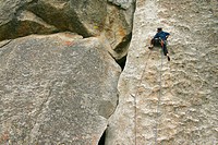 Female climber leading a route in City of Rocks, Idaho, USA