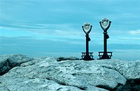 Binoculars overlooking a rocky shore, Maine, USA