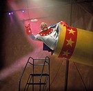 Human cannonball circus act preparing to launch.