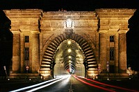 The monumental entrance to the road tunnel that runs through Castle Hill on Clark Adam Ter by night, Budapest, Hungary.
