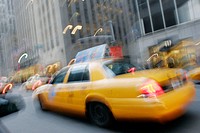 Yellow taxi cabs, blur, motion, movement, speed. Avenue of the Americas. Midtown Manhattan. New York. USA.
