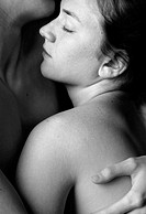 Male and female nude embracing