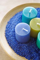 Candles in blue sand