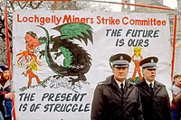 Police officers standing in front of a banner during a demonstration of support for the miners strike 1984, Glasgow, Scotland. UK.