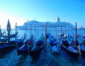 Gondolas and cruise ship, Venice. Veneto, Italy