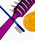 Close-up of toothbrush, hairbrush and soap