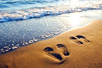couples footprints on beach,