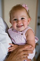 Portrait of smiling infant girl.