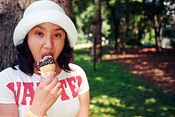 Hispanic woman eating ice-creamm in Central Park, New York City