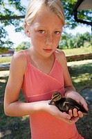 Girl with baby duck