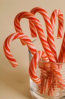 Christmas candy canes in clear glass