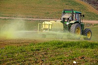 Tractor spraying field. Axarquia. Málaga province. Andalucia. Spain.