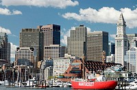 Boston skyline with lightship Nantucket from harbor, Boston, Massachusetts, USA.