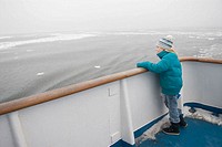 Girl at ferryboat deck in the winter. Åland Islands. Finland