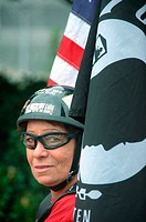 Vietnam vet woman and cycle helmit and flag biker chick POW