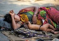 Mother and son sleeping in the streets of Calcutta, India