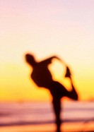 Runner, stretching, beach, Santa Barbara, CA, USA.
