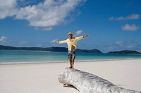 Man with arms outstretched.  Whitehaven Beach, Australia.