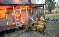 Firefighters fight a house fire in Bowie, Maryland, USA