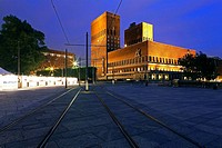 Oslo Town Hall, seen from Aker Brygge with tram lines in the foreground, Oslo, Norway