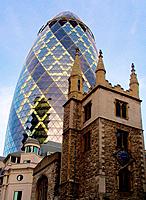 Swiss Re tower and St Andrew Undershaft church, London. England, UK