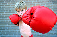 Boy practices boxing.