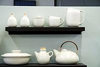 White ceramic tableware including pitcher, creamer and sugar, tea pot, covered serving dish