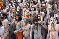 Naga Sadhus returning from bathing in The holy river Ganges at Kumbh Mela Festival. Allahabad, Uttar Pradesh, India