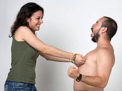 Young newlywed girl pinching her husband´s nipples