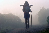 A pilgrim on the Camino de Santiago Camino Frances route by passing Portomarín