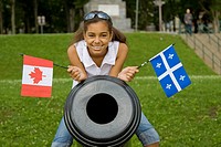 Quebec City, Canada - 12-year-old biracial girl with the flags of Canada and Quebec   Model Release Available