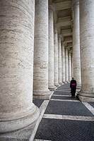Cardinal walking to S. Peter Church, between the Bernini´s colonnade, Vatican City, Rome, Italy
