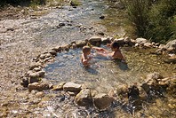 Brothers playing on a handmade pool on Villahermosa river, Ludiente, Castellón, Comunidad Valenciana, Spain, Europe