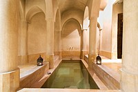 Morocco, Marrakesh, Riad, the Hammam  with its tadelakt plaster columns and pool subtly lit by shafts of light